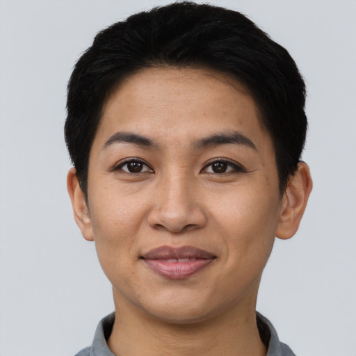 Joyful asian young-adult female with short  black hair and brown eyes