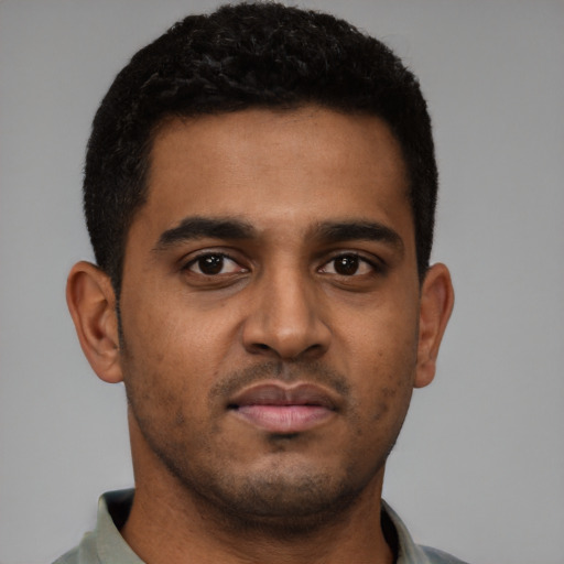 Neutral black young-adult male with short  brown hair and brown eyes