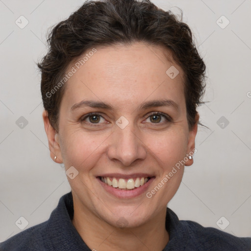 Joyful white adult female with short  brown hair and grey eyes