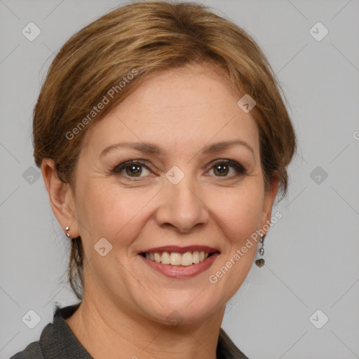 Joyful white adult female with medium  brown hair and grey eyes