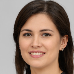 Joyful white young-adult female with medium  brown hair and brown eyes