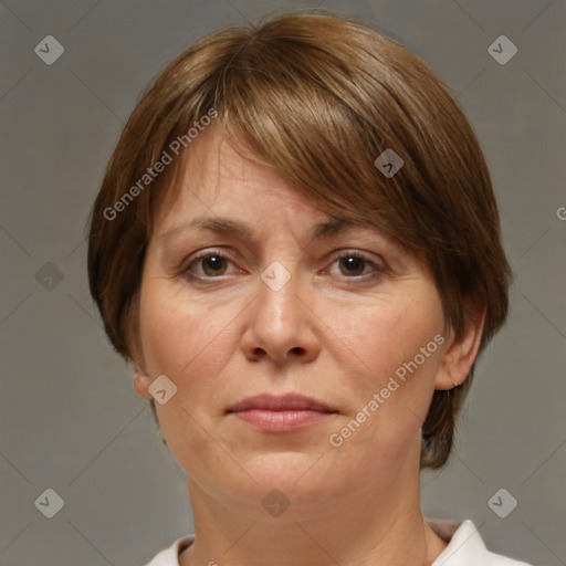 Joyful white adult female with medium  brown hair and brown eyes