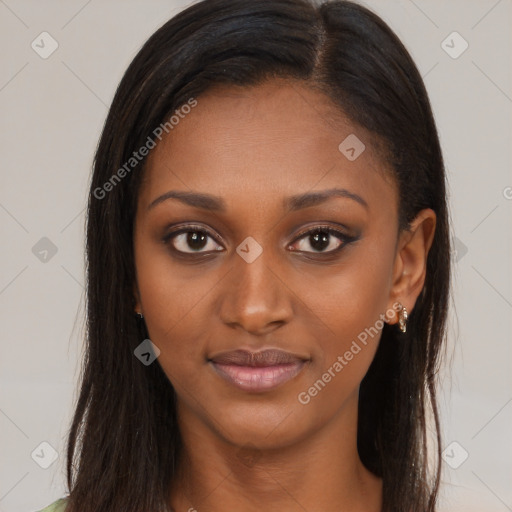 Joyful black young-adult female with long  brown hair and brown eyes