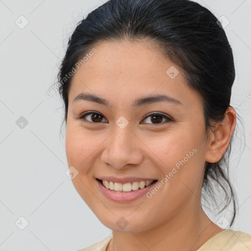 Joyful white young-adult female with medium  brown hair and brown eyes