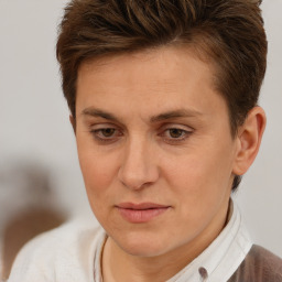 Joyful white adult female with short  brown hair and brown eyes