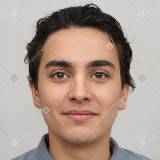 Joyful white young-adult male with short  black hair and brown eyes