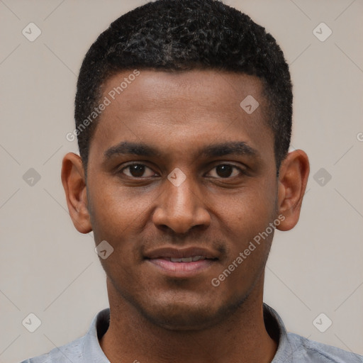 Joyful black young-adult male with short  black hair and brown eyes