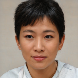 Joyful asian young-adult female with short  brown hair and brown eyes