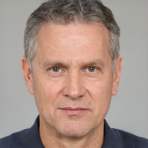 Neutral white middle-aged male with short  gray hair and brown eyes