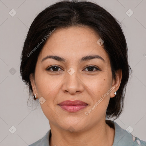 Joyful latino young-adult female with medium  brown hair and brown eyes