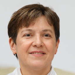 Joyful white adult female with short  brown hair and brown eyes