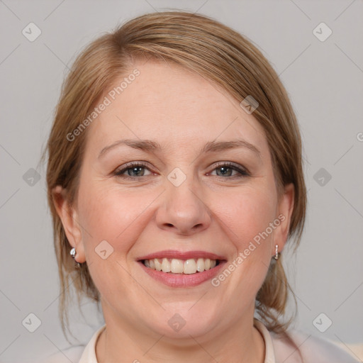 Joyful white adult female with medium  brown hair and blue eyes