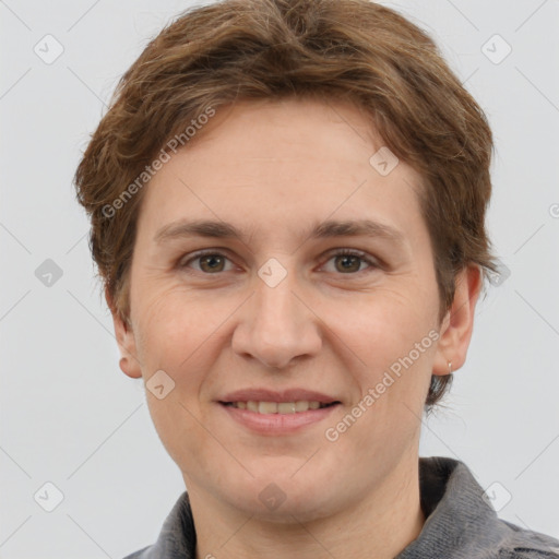 Joyful white adult female with short  brown hair and grey eyes