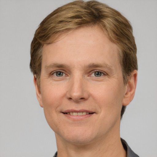 Joyful white adult male with short  brown hair and grey eyes