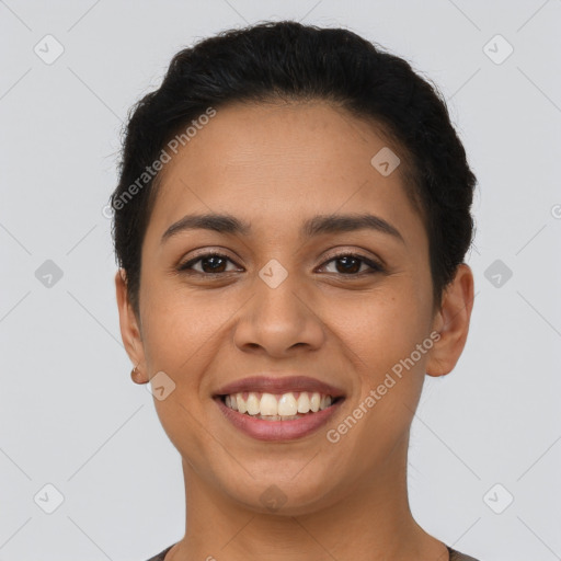 Joyful latino young-adult female with short  brown hair and brown eyes