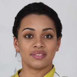 Joyful black young-adult female with short  brown hair and brown eyes