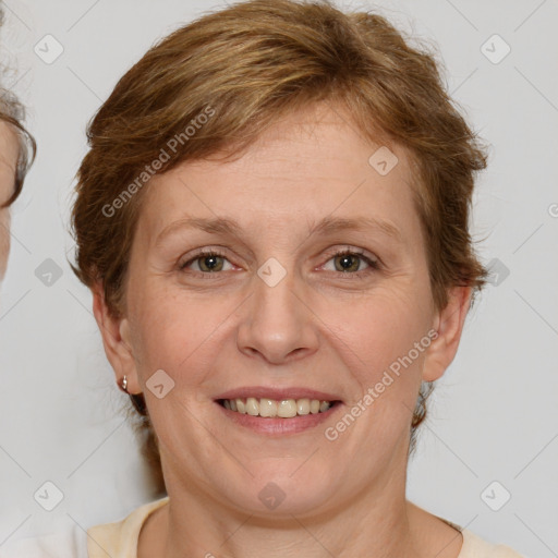 Joyful white adult female with medium  brown hair and brown eyes