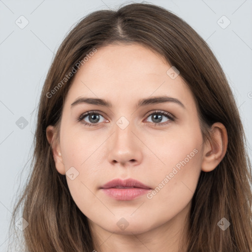 Neutral white young-adult female with long  brown hair and brown eyes