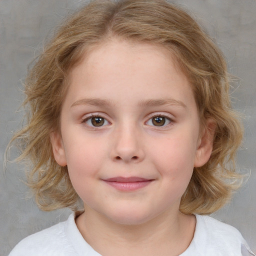 Joyful white child female with medium  brown hair and brown eyes