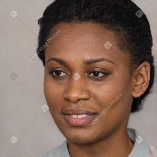 Joyful black young-adult female with short  brown hair and brown eyes