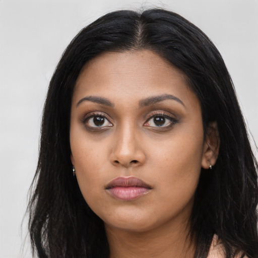 Neutral latino young-adult female with long  black hair and brown eyes