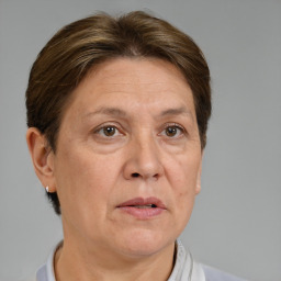 Joyful white middle-aged female with short  brown hair and brown eyes