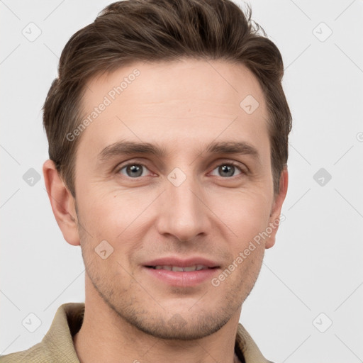 Joyful white young-adult male with short  brown hair and grey eyes