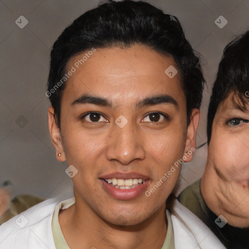 Joyful latino young-adult male with short  black hair and brown eyes