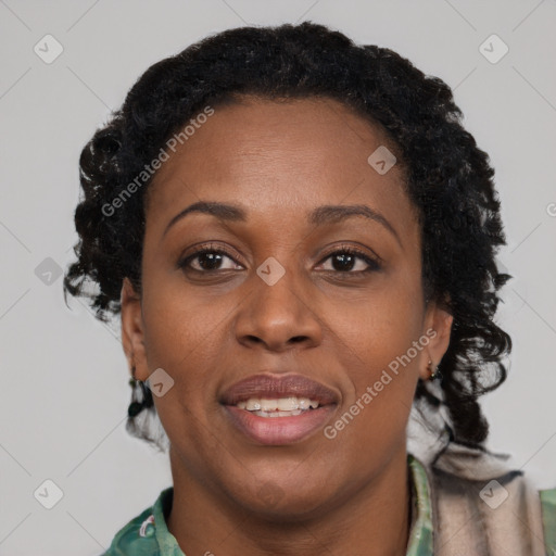 Joyful black adult female with short  brown hair and brown eyes