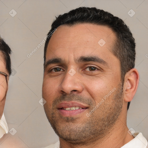 Joyful white young-adult male with short  black hair and brown eyes