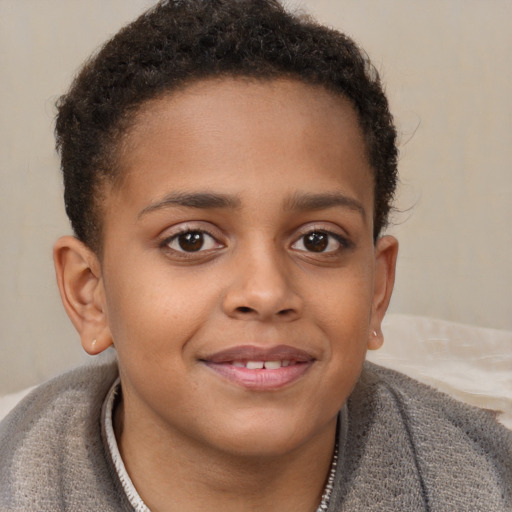 Joyful black child female with short  brown hair and brown eyes