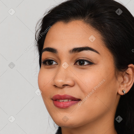 Joyful asian young-adult female with long  brown hair and brown eyes