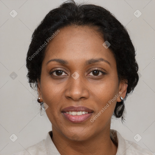 Joyful black adult female with medium  brown hair and brown eyes