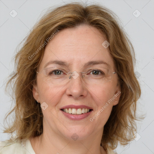 Joyful white adult female with medium  brown hair and green eyes