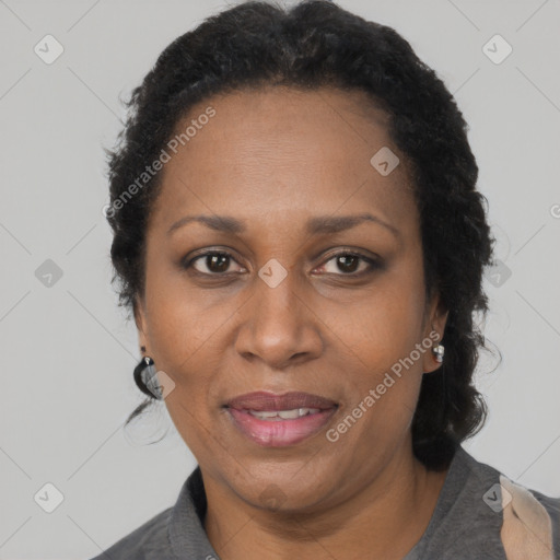 Joyful black adult female with short  brown hair and brown eyes