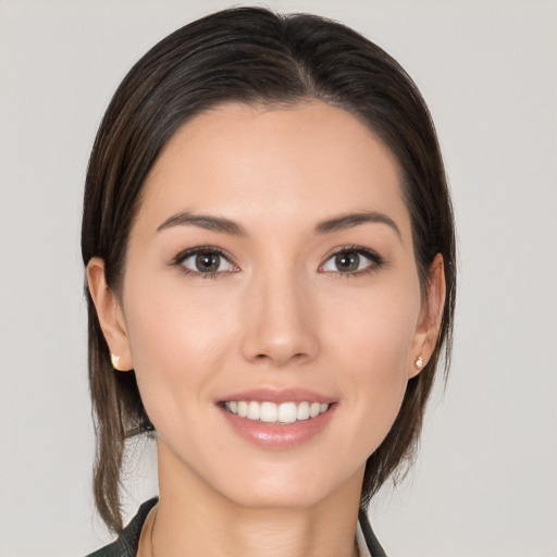 Joyful white young-adult female with medium  brown hair and brown eyes