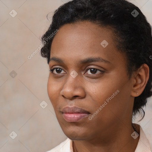 Neutral black young-adult female with short  black hair and brown eyes