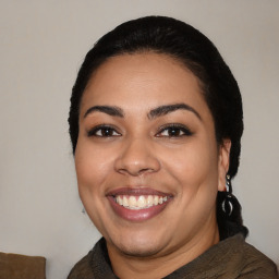 Joyful latino young-adult female with medium  black hair and brown eyes