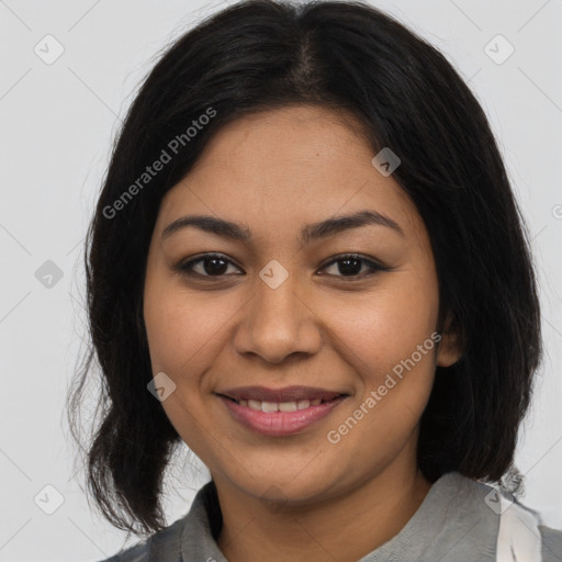 Joyful latino young-adult female with medium  brown hair and brown eyes