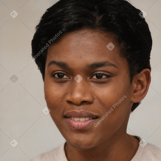 Joyful black young-adult female with short  black hair and brown eyes