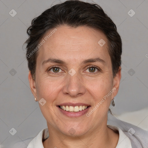 Joyful white adult female with short  brown hair and brown eyes