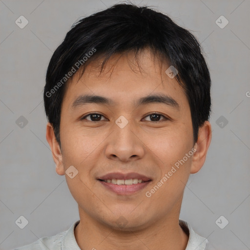 Joyful asian young-adult male with short  black hair and brown eyes