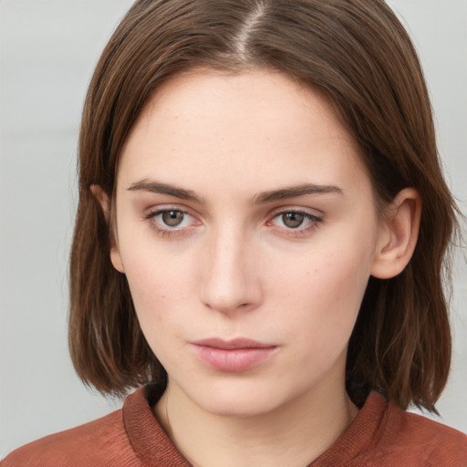 Neutral white young-adult female with medium  brown hair and grey eyes