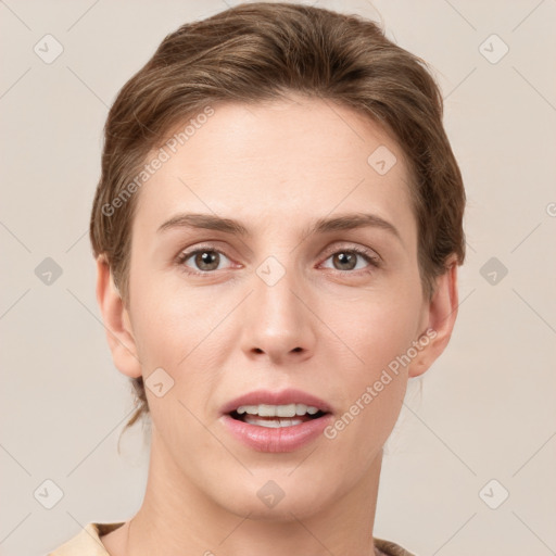 Joyful white young-adult female with short  brown hair and grey eyes