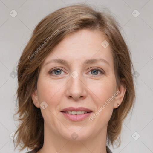 Joyful white young-adult female with medium  brown hair and blue eyes