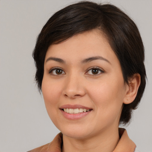 Joyful white young-adult female with medium  brown hair and brown eyes