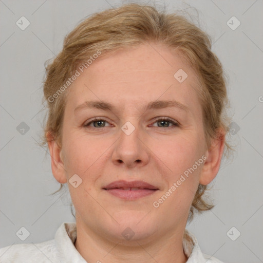 Joyful white adult female with medium  brown hair and blue eyes