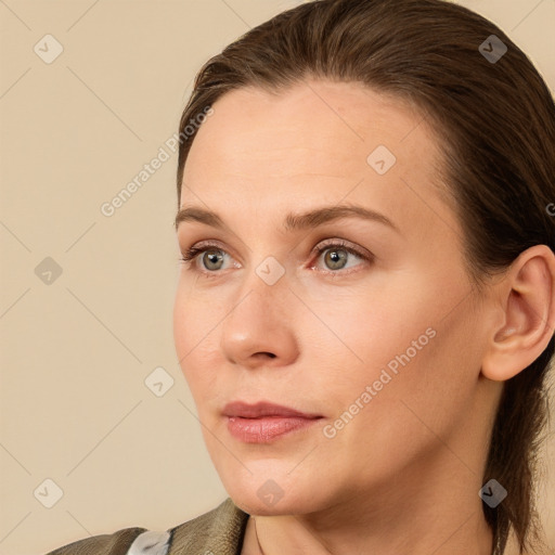 Neutral white young-adult female with long  brown hair and blue eyes