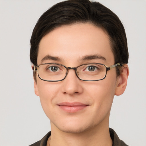 Joyful white young-adult male with short  brown hair and grey eyes