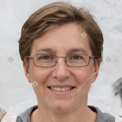 Joyful white adult female with short  brown hair and grey eyes